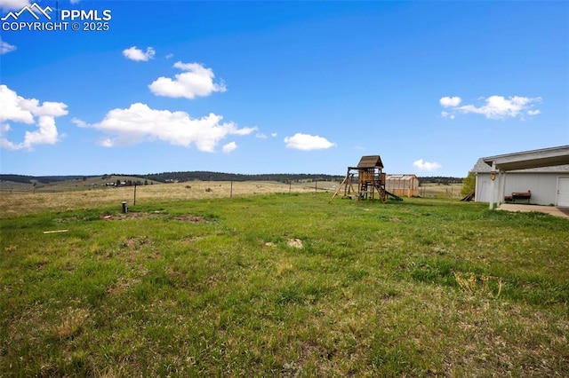 527 Golden Grain Ln, Divide, CO 80814 - view of grassy yard with a playground