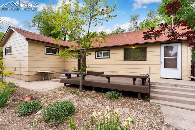 15 W Brookside St, Colorado Springs, CO 80905 - back of house featuring a wooden deck and roof with shingles