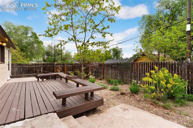 15 W Brookside St, Colorado Springs, CO 80905 - wooden deck with a fenced backyard and a patio