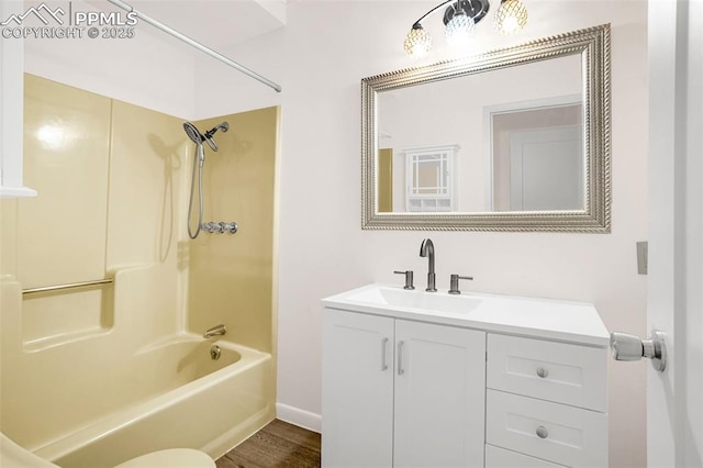 1604 E Kiowa St, Colorado Springs, CO 80909 - full bathroom featuring vanity, bathtub / shower combination, and wood finished floors