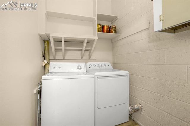 1604 E Kiowa St, Colorado Springs, CO 80909 - laundry area featuring separate washer and dryer and concrete block wall