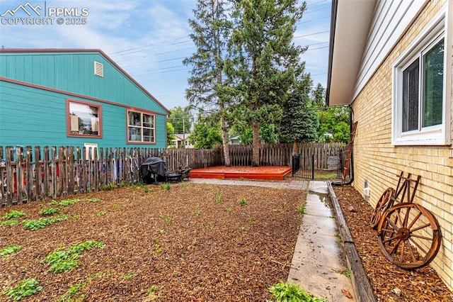 1604 E Kiowa St, Colorado Springs, CO 80909 - fenced backyard with a wooden deck