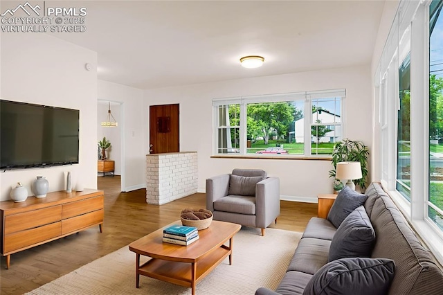 1604 E Kiowa St, Colorado Springs, CO 80909 - living room featuring wood finished floors and baseboards