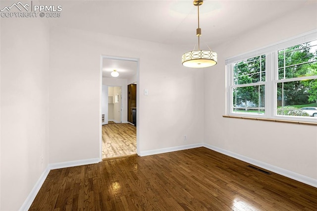 1604 E Kiowa St, Colorado Springs, CO 80909 - unfurnished room featuring wood finished floors