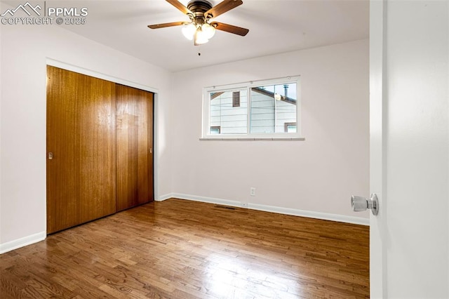1604 E Kiowa St, Colorado Springs, CO 80909 - unfurnished bedroom with wood finished floors, a closet, and ceiling fan