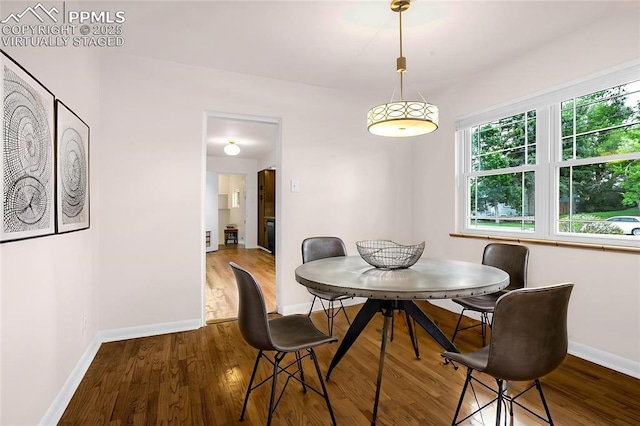 1604 E Kiowa St, Colorado Springs, CO 80909 - dining space with wood finished floors and baseboards