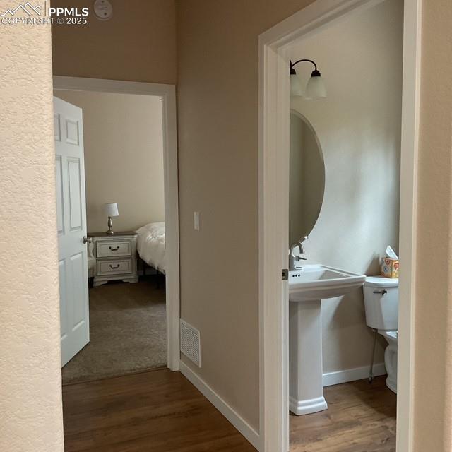 71 Mt Elbert Dr, Florissant, CO 80816 - hallway featuring wood finished floors and baseboards