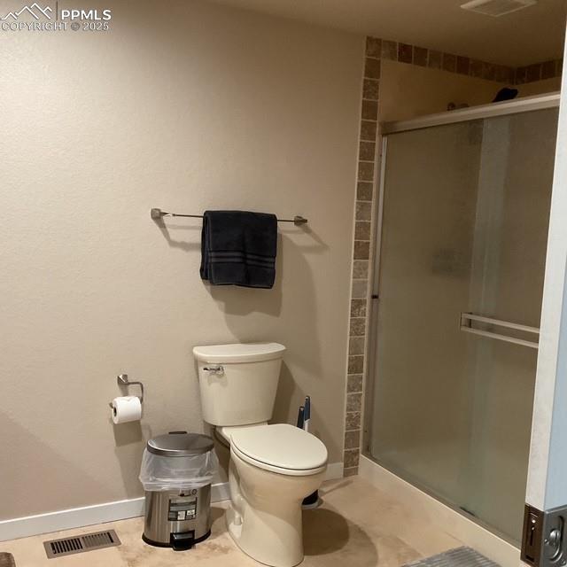 71 Mt Elbert Dr, Florissant, CO 80816 - full bathroom featuring a shower stall, toilet, and baseboards