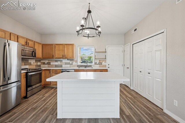 4807 Kerry Lynn Vw Unit 102, Colorado Springs, CO 80922 - kitchen featuring appliances with stainless steel finishes, a sink, dark wood-style flooring, and light countertops