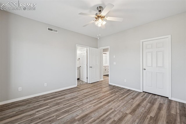 4807 Kerry Lynn Vw Unit 102, Colorado Springs, CO 80922 - unfurnished bedroom with wood finished floors, baseboards, ensuite bathroom, and a ceiling fan