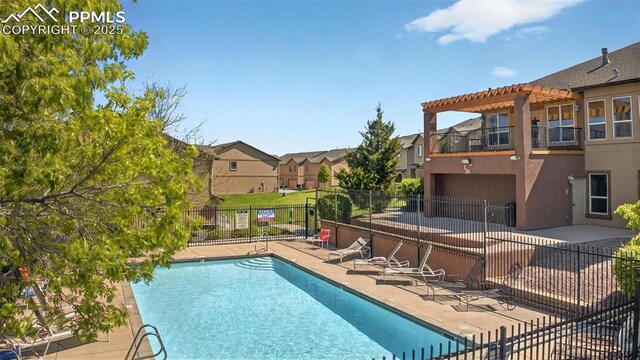 4807 Kerry Lynn Vw Unit 102, Colorado Springs, CO 80922 - community pool with a patio, a pergola, and a residential view