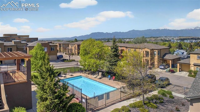 4807 Kerry Lynn Vw Unit 102, Colorado Springs, CO 80922 - community pool featuring a residential view, a mountain view, and a patio area