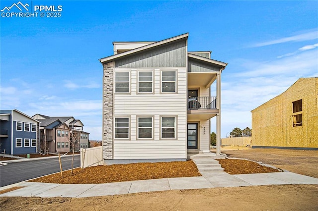 3071 Curly Grv, Colorado Springs, CO 80922 - view of front of property featuring a balcony and stone siding