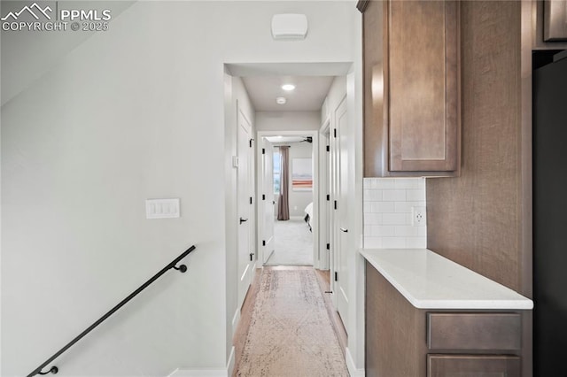 3071 Curly Grv, Colorado Springs, CO 80922 - corridor featuring baseboards and an upstairs landing