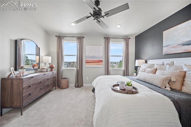 3071 Curly Grv, Colorado Springs, CO 80922 - bedroom with light carpet, multiple windows, recessed lighting, a ceiling fan, and baseboards