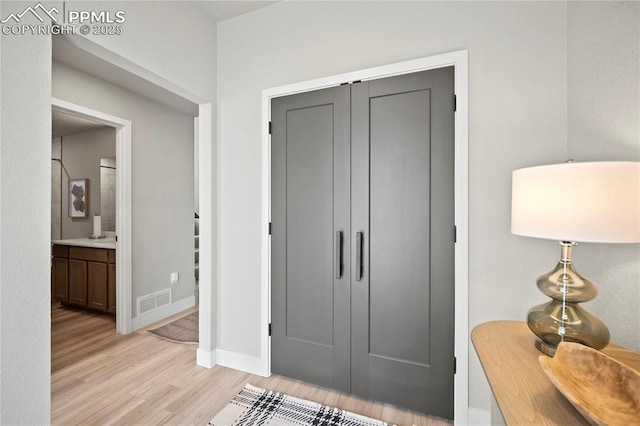 3071 Curly Grv, Colorado Springs, CO 80922 - entrance foyer with light wood-type flooring and baseboards