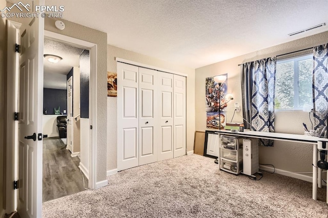 3566 Verde Dr, Colorado Springs, CO 80910 - office featuring a textured ceiling, a textured wall, carpet floors, and baseboards