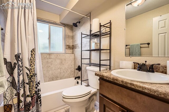 3566 Verde Dr, Colorado Springs, CO 80910 - bathroom with shower / tub combo, toilet, vanity, and a textured wall