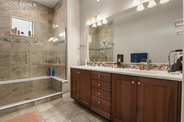 10192 Kentwood Dr, Colorado Springs, CO 80924 - bathroom with double vanity, a stall shower, and tile patterned floors
