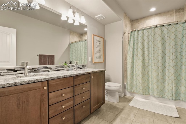 10192 Kentwood Dr, Colorado Springs, CO 80924 - bathroom featuring double vanity, tile patterned floors, toilet, and shower / tub combo with curtain