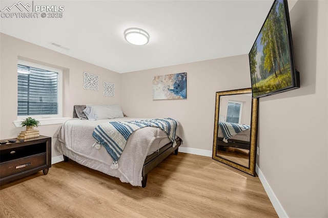 2625 Steele St, Denver, CO 80205 - bedroom with light wood-style flooring and baseboards