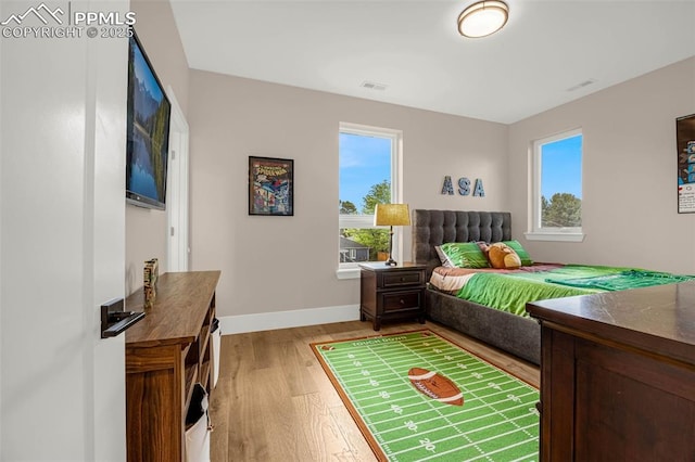 2625 Steele St, Denver, CO 80205 - bedroom with light wood-type flooring and baseboards