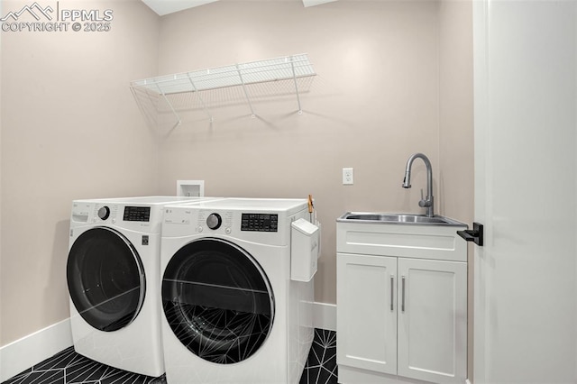 2625 Steele St, Denver, CO 80205 - laundry room with cabinet space, washer and clothes dryer, baseboards, and tile patterned floors