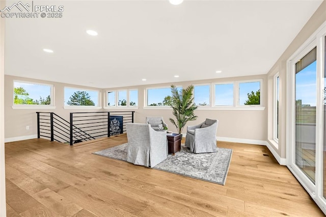 2625 Steele St, Denver, CO 80205 - sitting room with an upstairs landing, baseboards, light wood-type flooring, and recessed lighting