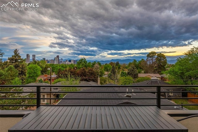 2625 Steele St, Denver, CO 80205 - deck at dusk with view of wooded area