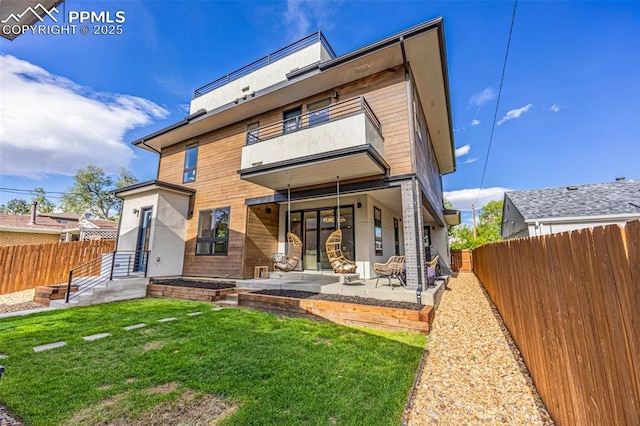 2625 Steele St, Denver, CO 80205 - rear view of house featuring a balcony and a patio