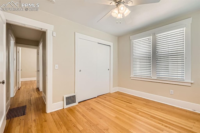 228 N Hancock Ave, Colorado Springs, CO 80903 - unfurnished bedroom with light wood-type flooring, a closet, baseboards, and a ceiling fan