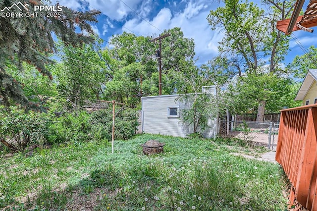 228 N Hancock Ave, Colorado Springs, CO 80903 - view of yard with a fire pit and an outdoor structure