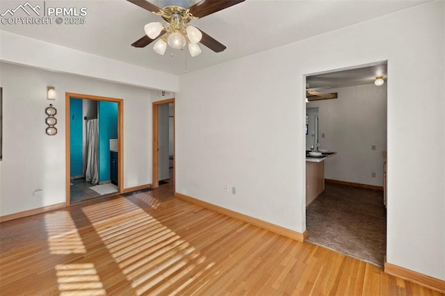 229 E Washington St, Colorado Springs, CO 80907 - spare room featuring a ceiling fan, light wood-style floors, and baseboards