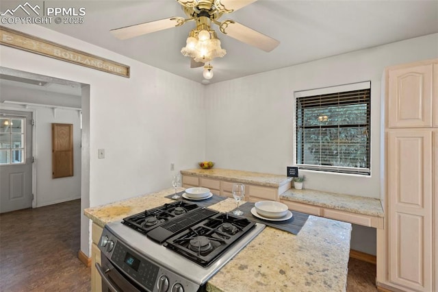 229 E Washington St, Colorado Springs, CO 80907 - kitchen with stainless steel gas stove, ceiling fan, stovetop with downdraft, baseboards, and wood finished floors