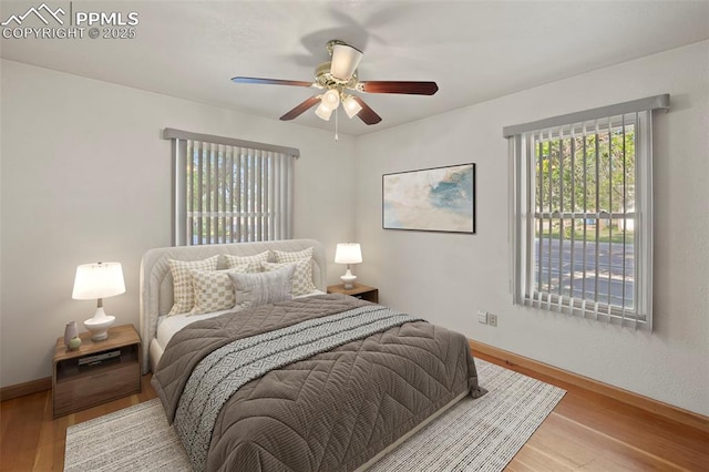 229 E Washington St, Colorado Springs, CO 80907 - bedroom with wood finished floors, baseboards, and ceiling fan