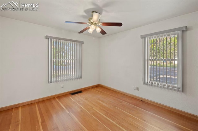 229 E Washington St, Colorado Springs, CO 80907 - spare room featuring baseboards, a ceiling fan, and hardwood / wood-style flooring
