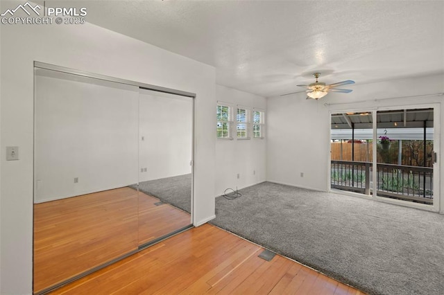 229 E Washington St, Colorado Springs, CO 80907 - spare room with ceiling fan, hardwood / wood-style flooring, a textured ceiling, and baseboards