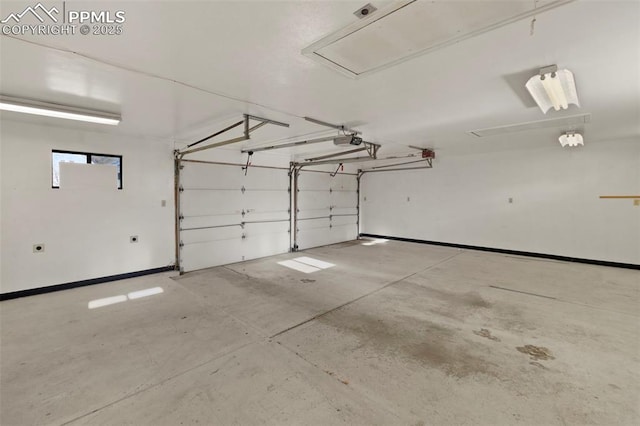 229 E Washington St, Colorado Springs, CO 80907 - garage with a garage door opener and baseboards