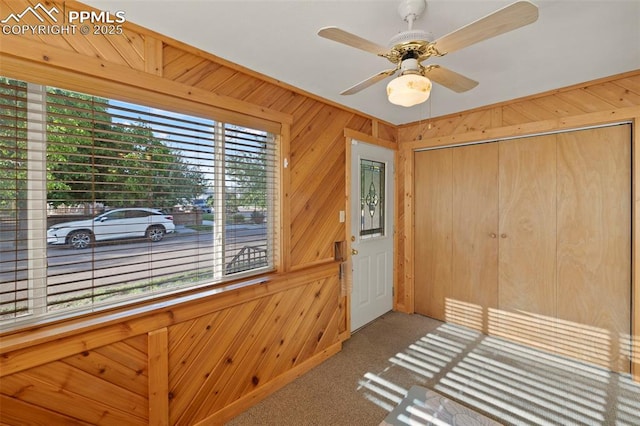 229 E Washington St, Colorado Springs, CO 80907 - carpeted foyer featuring wooden walls and ceiling fan
