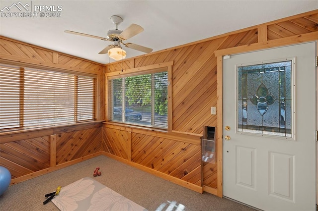 229 E Washington St, Colorado Springs, CO 80907 - foyer with wooden walls, carpet flooring, and a ceiling fan
