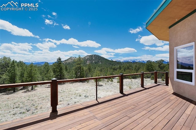 610 Matterhorn Cir, Westcliffe, CO 81252 - wooden terrace with a wooded view and a mountain view