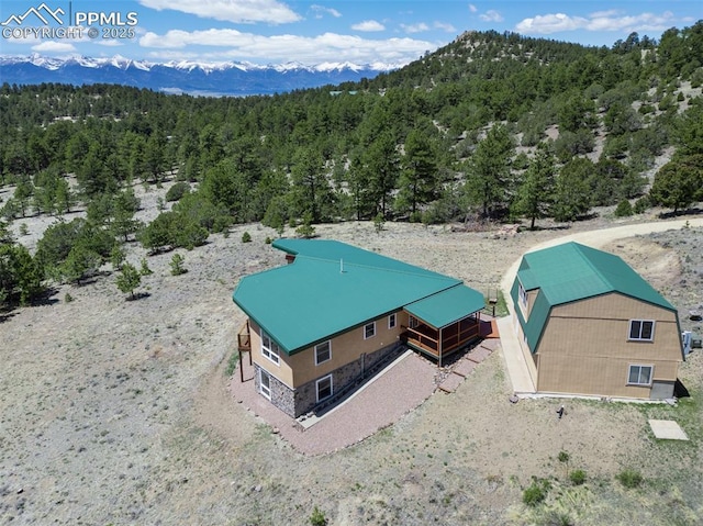 610 Matterhorn Cir, Westcliffe, CO 81252 - aerial view of property and surrounding area with a heavily wooded area and mountains
