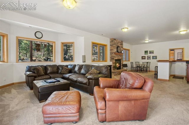 20190 Deer Shadow Way, Monument, CO 80132 - living room with carpet floors, a stone fireplace, and baseboards