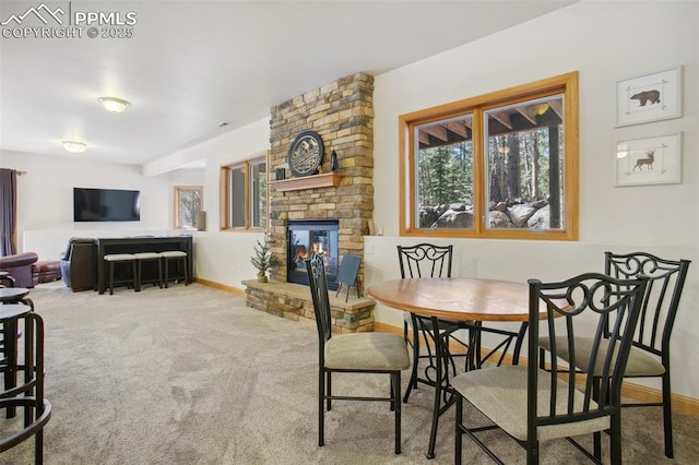 20190 Deer Shadow Way, Monument, CO 80132 - dining room with carpet and a large fireplace