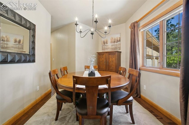 20190 Deer Shadow Way, Monument, CO 80132 - dining space featuring a chandelier, baseboards, and wood finished floors
