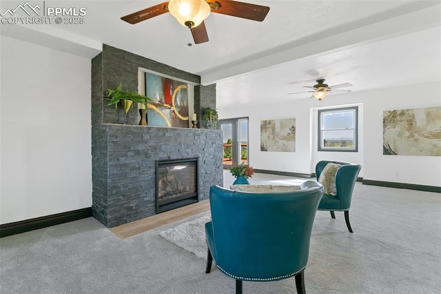 16030 Alta Plaza Cir, Peyton, CO 80831 - living area with ceiling fan, carpet flooring, and a glass covered fireplace