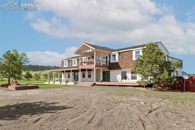 16030 Alta Plaza Cir, Peyton, CO 80831 - back of property featuring a balcony and covered porch