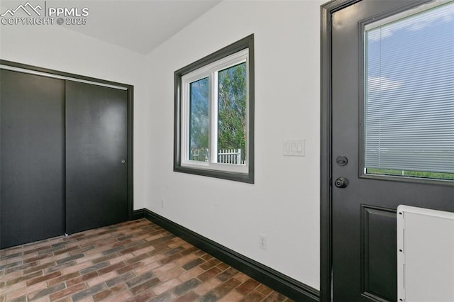 16030 Alta Plaza Cir, Peyton, CO 80831 - foyer with brick flooring and baseboards