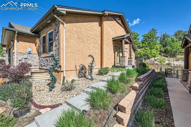2252 Conservatory Pt, Colorado Springs, CO 80918 - view of home's exterior with stucco siding and stone siding