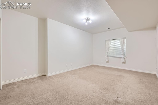 2252 Conservatory Pt, Colorado Springs, CO 80918 - unfurnished room with carpet, baseboards, and a textured ceiling